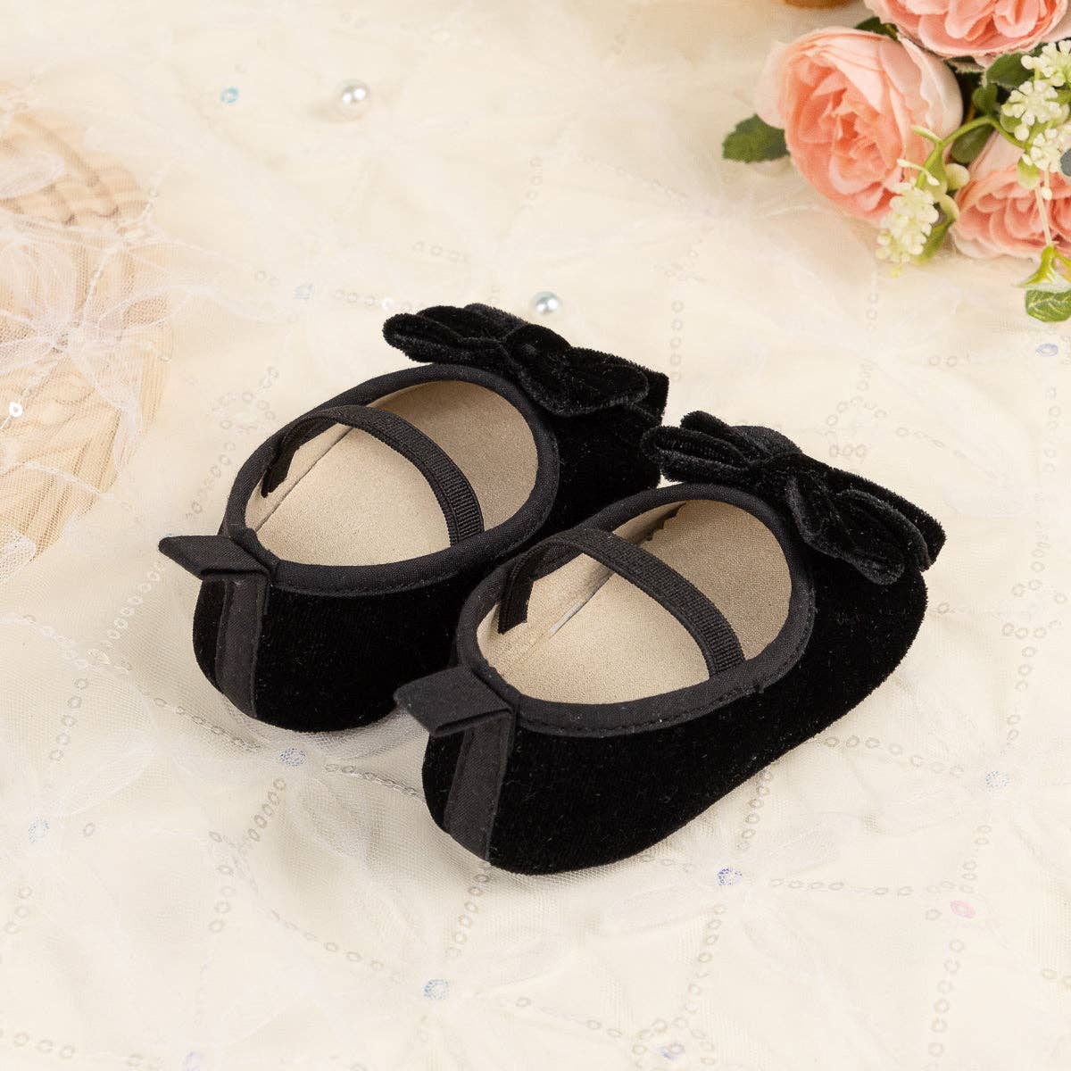 Front Bow velvety baby shoes, available in black.