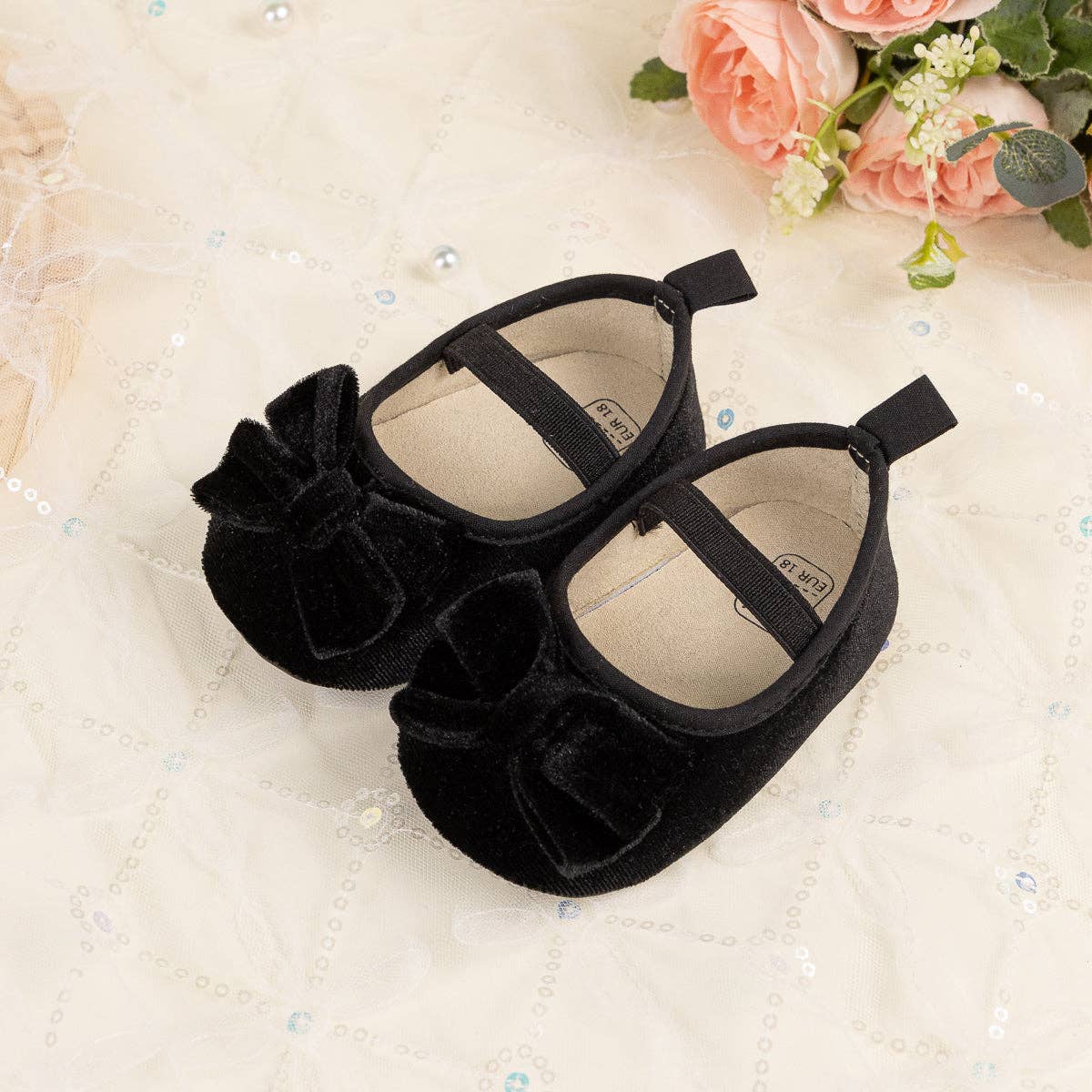 Front Bow velvety baby shoes, available in black.